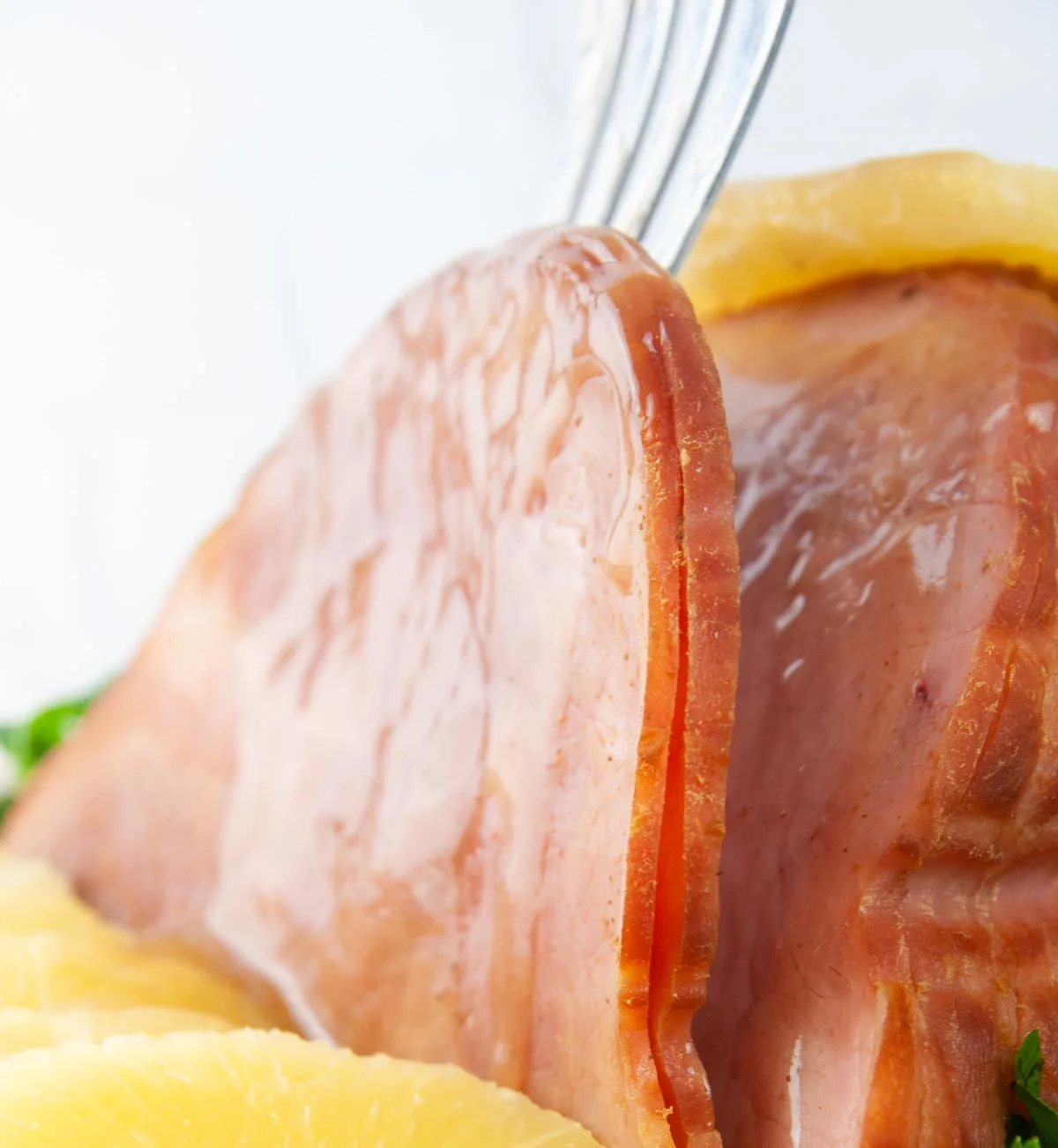 Instant Pot Ham with Honey Glaze is a delicious holiday dinner main dish you can make any time. This foolproof recipe produces results that rival Honey Baked ham but for a fraction of the cost and in no time at all.