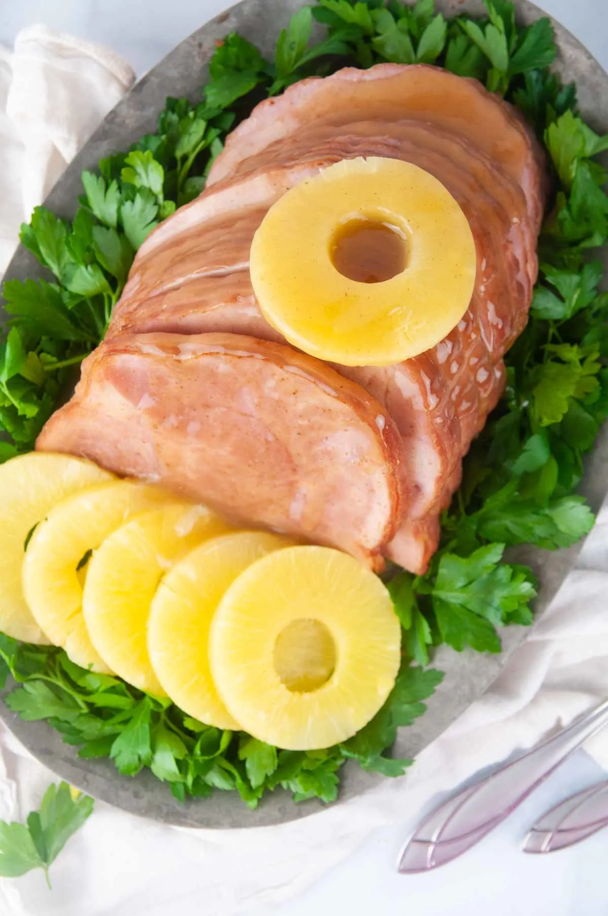 Instant Pot Ham with Honey Glaze is a delicious holiday dinner main dish you can make any time. This foolproof recipe produces results that rival Honey Baked ham but for a fraction of the cost and in no time at all.