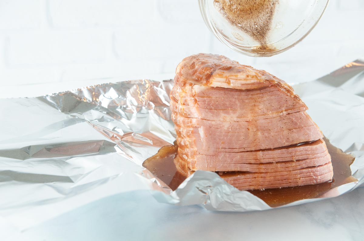 Put the ham in foil and pour the marinade over it.