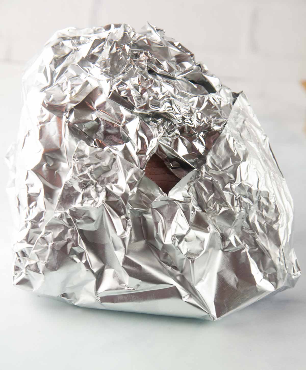 Wrap the ham tightly with foil.