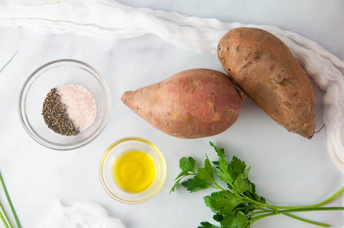 Ingredients for easy air fryer sweet potato fries: sweet potatoes, olive oil and salt and pepper