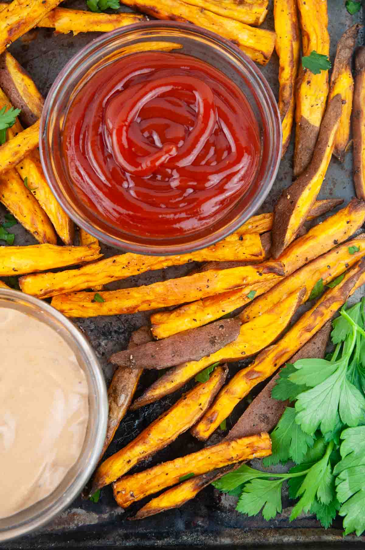 Easy air fryer sweet potatoes are the perfect thing to dunk into ketchup.