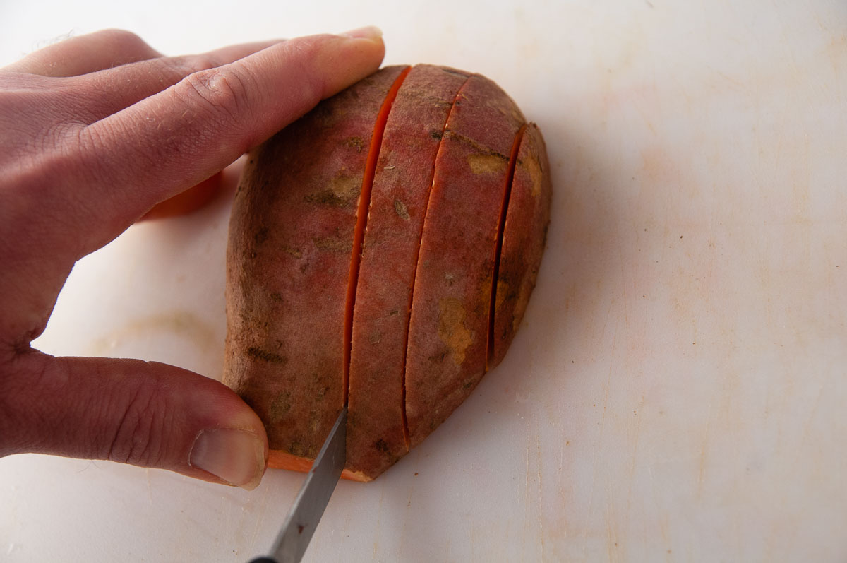 Make roughly 1/4 inch to 1/2 thick slices in the sweet potato.