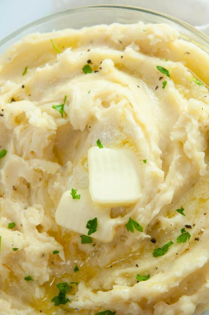 Fluffy roasted garlic mashed potatoes are buttery and a perfect side for a holiday dinner or Sunday roast.