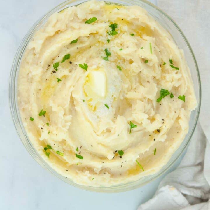 Fluffy roasted garlic mashed potatoes are buttery and a perfect side for a holiday dinner or Sunday roast.