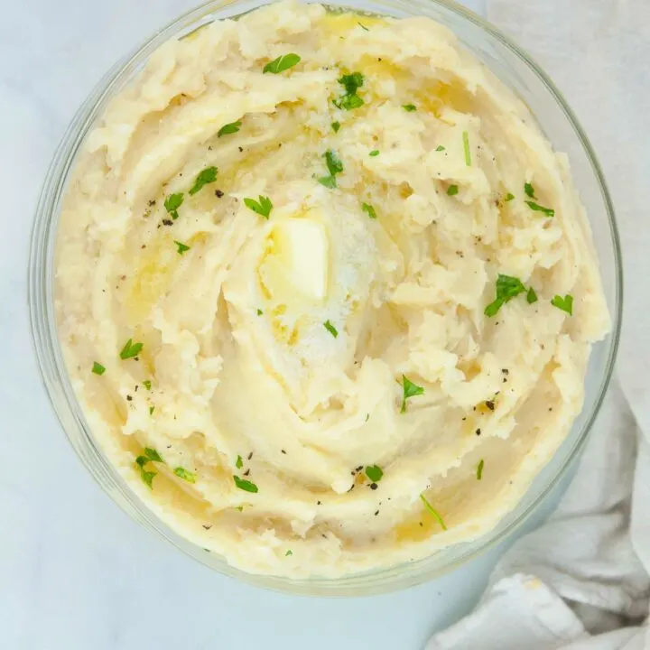 Fluffy roasted garlic mashed potatoes are buttery and a perfect side for a holiday dinner or Sunday roast.