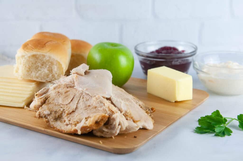 Ingredients for Turkey Cranberry Sliders: turkey, butter, cranberry sauce, apple, butter, Hawaiian rolls, mayonnaise