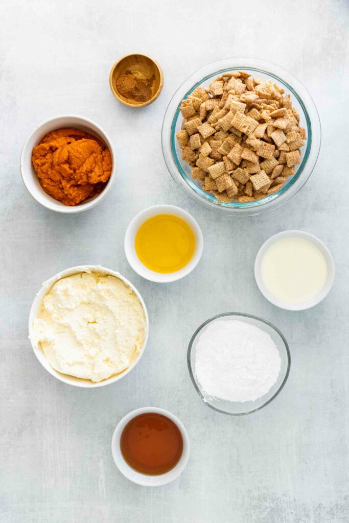Ingredients for No bake pumpkin cheesecake: mascarpone cheese, pumpkin puree, spices, honey, Chex, and melted butter