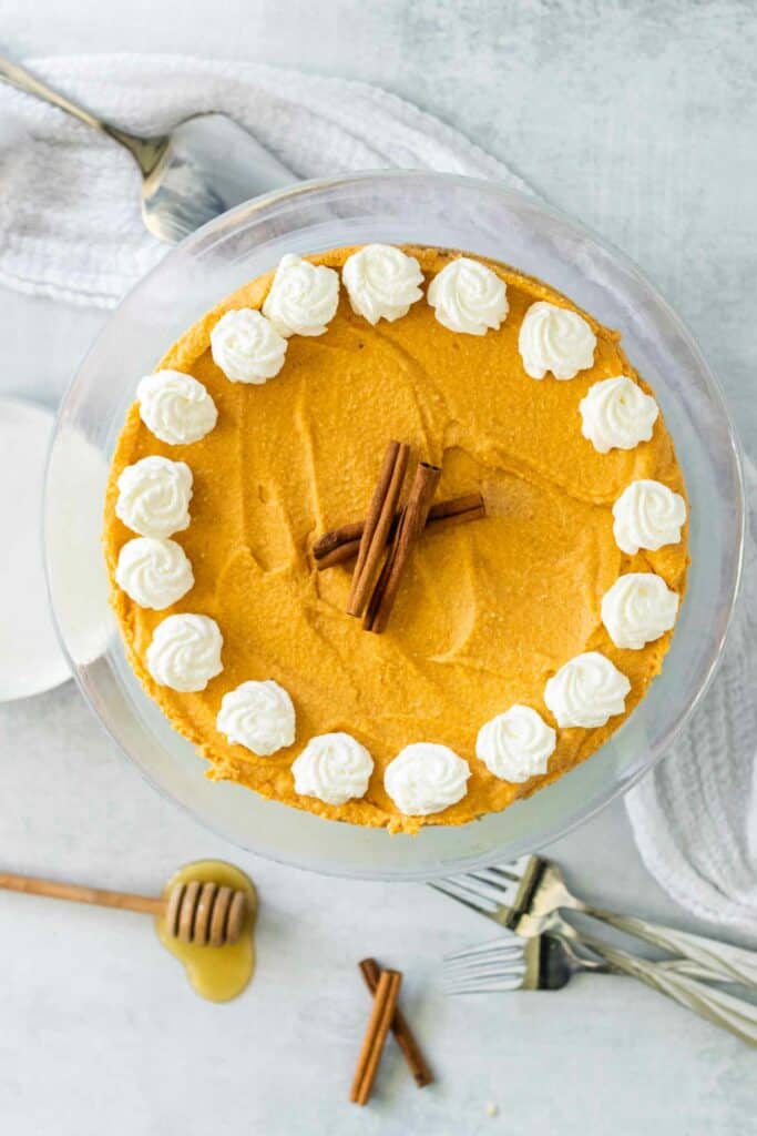 An uncut no bake pumpkin cheesecake makes a lovely holiday centerpiece