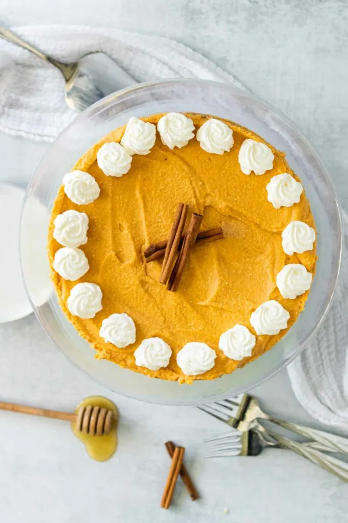 An uncut no bake pumpkin cheesecake makes a lovely holiday centerpiece