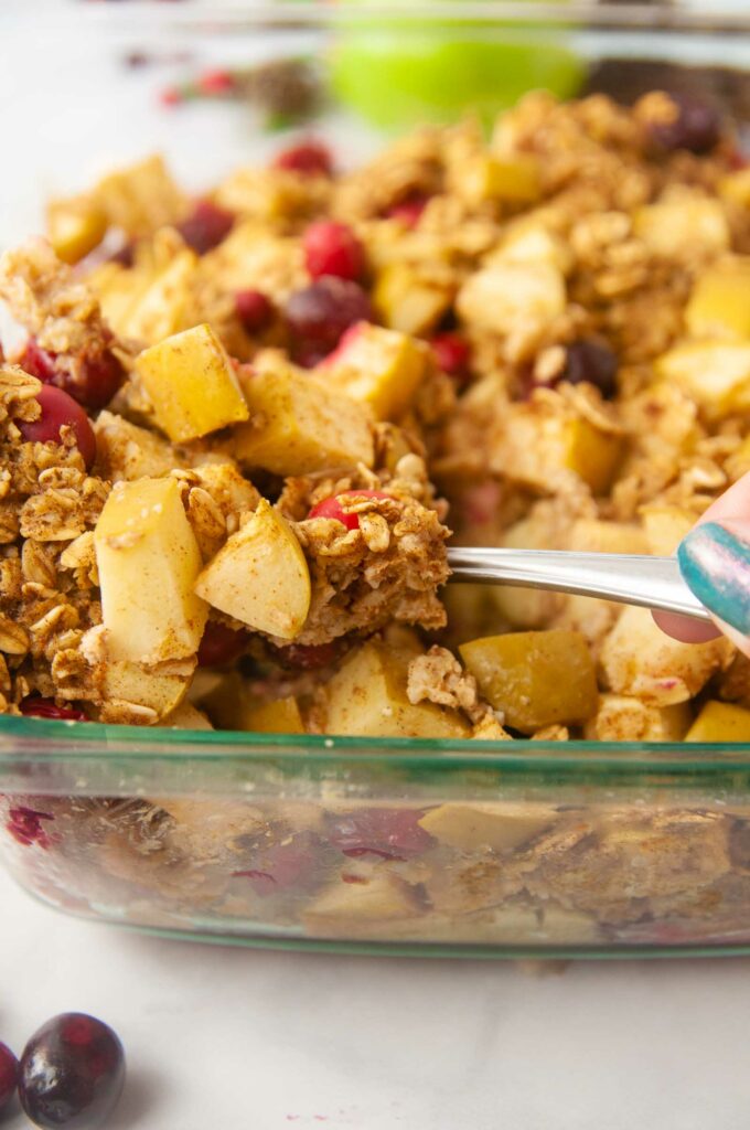 A spoonful of cozy, wholesome cranberry apple baked oatmeal.