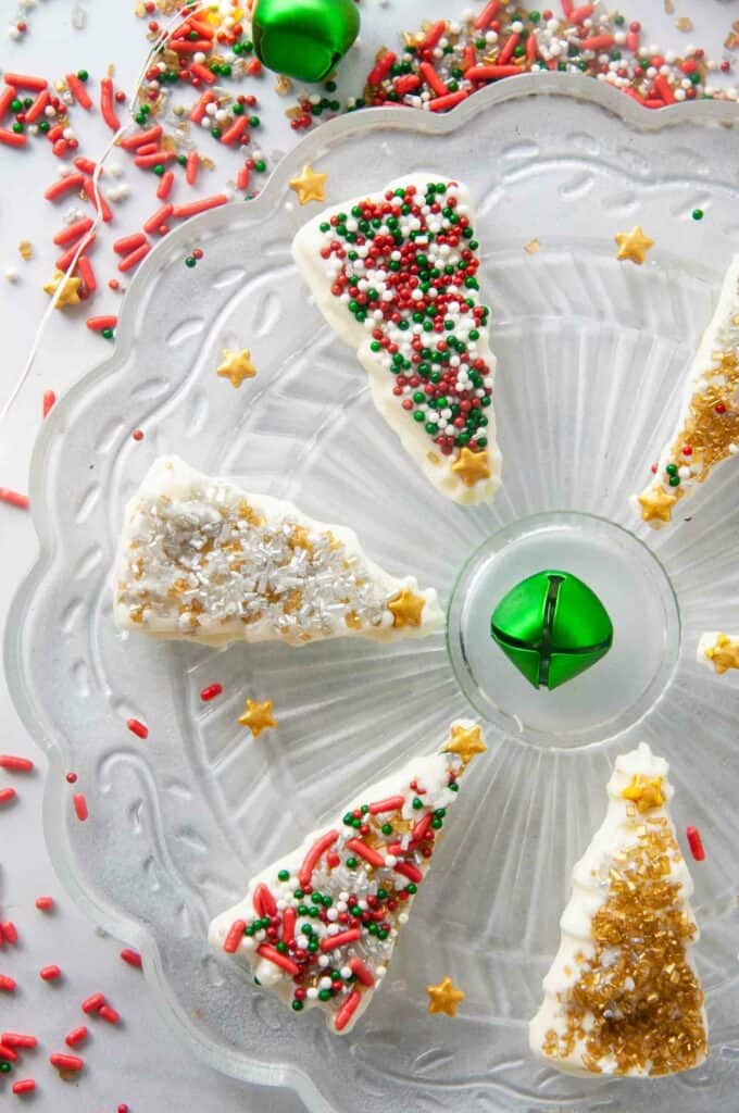 Festive sprinkles decorate homemade white chocolate Christmas trees 