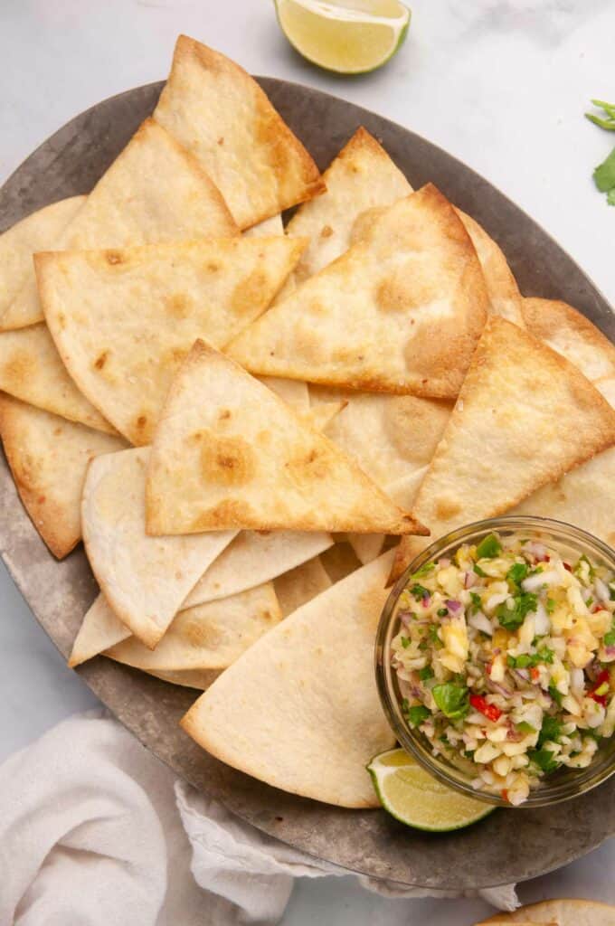 Learn how to make tortilla chips in the air fryer and the oven for a lighter way to satisfy your snack cravings.