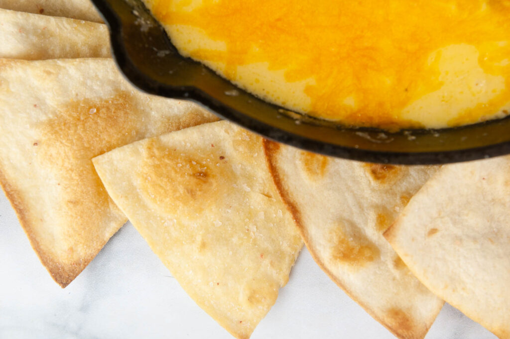 Learn how to make tortilla chips in the air fryer and the oven for a lighter way to satisfy your snack cravings.