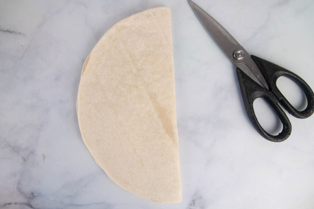 Fold the tortilla in half.