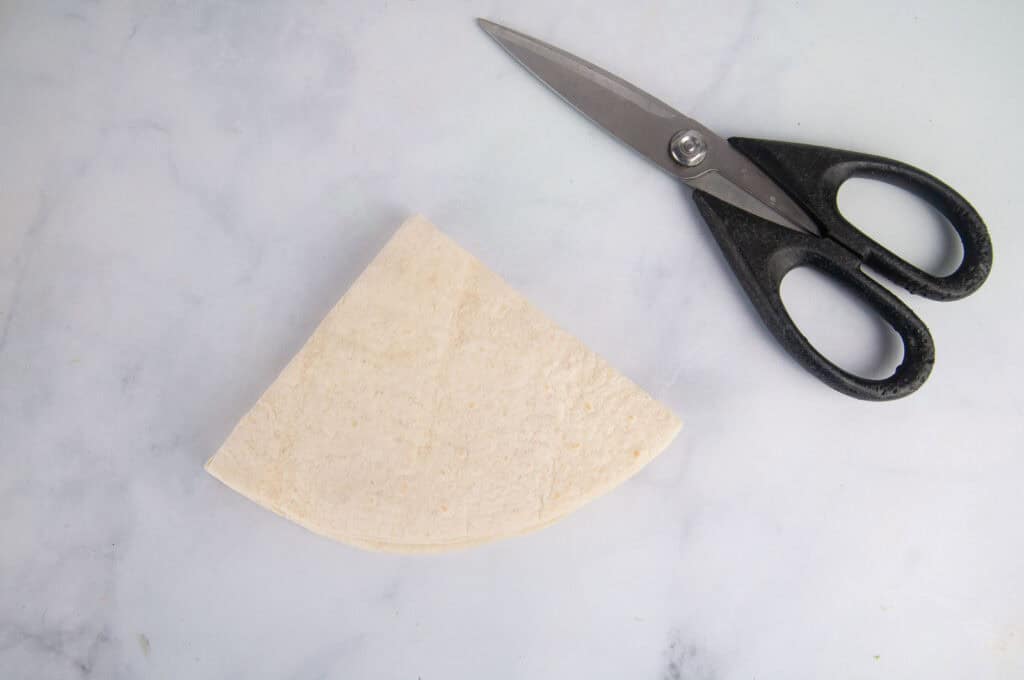 Fold the tortilla into quarters.