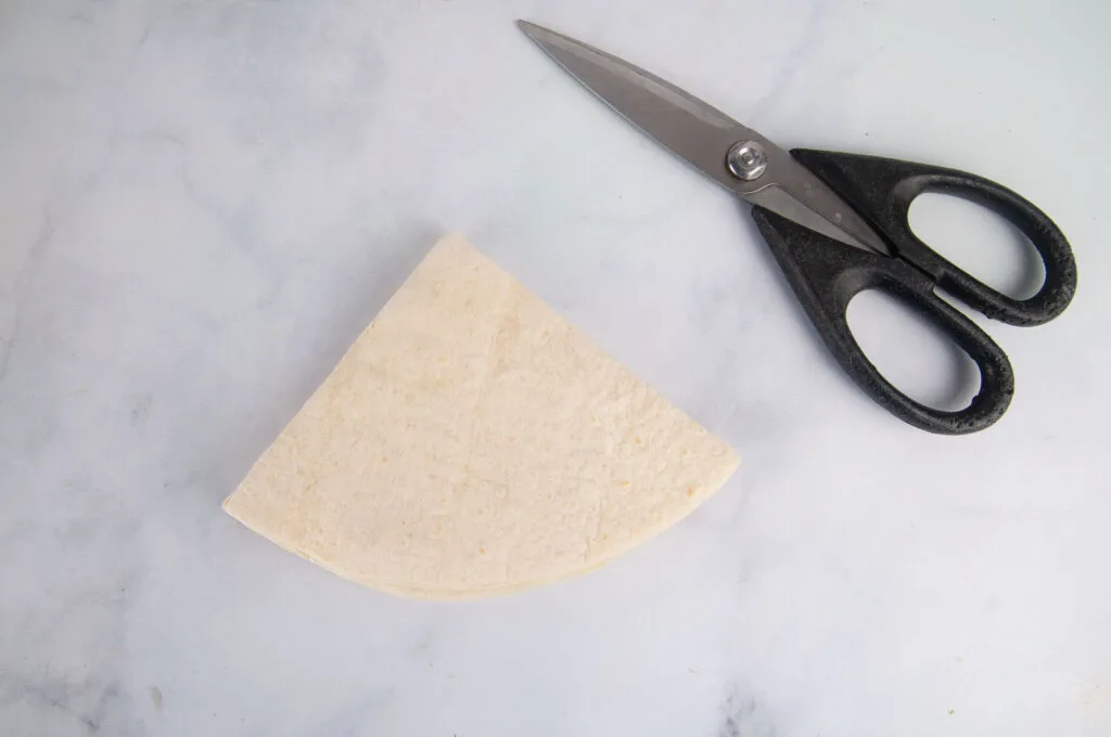 Fold the tortilla into quarters.