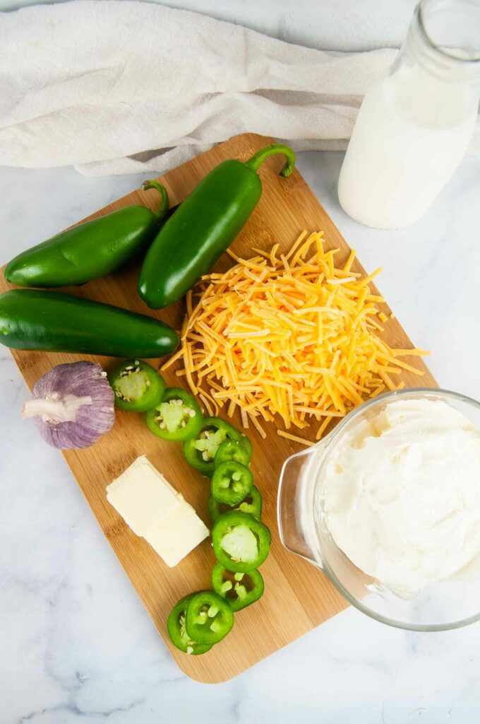 Ingredients for Jalapeno Popper Dip: Cream cheese, Jalapenos, Cheddar Cheese, Garlic, Butter, and Half and Half