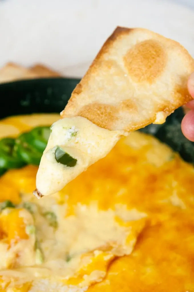 Dip a chip into jalapeno popper dip for the perfect appetizer experience