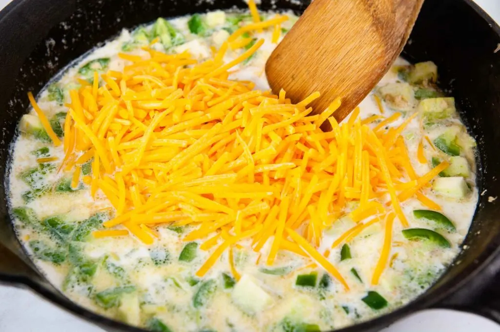 Stir the cheese into the jalapeno popper dip.