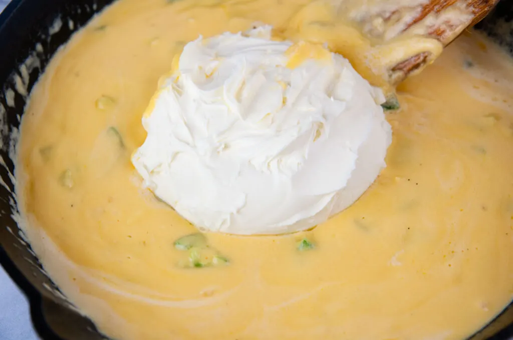 Stir in the cream cheese or mascarpone cheese to the jalapeno popper dip.