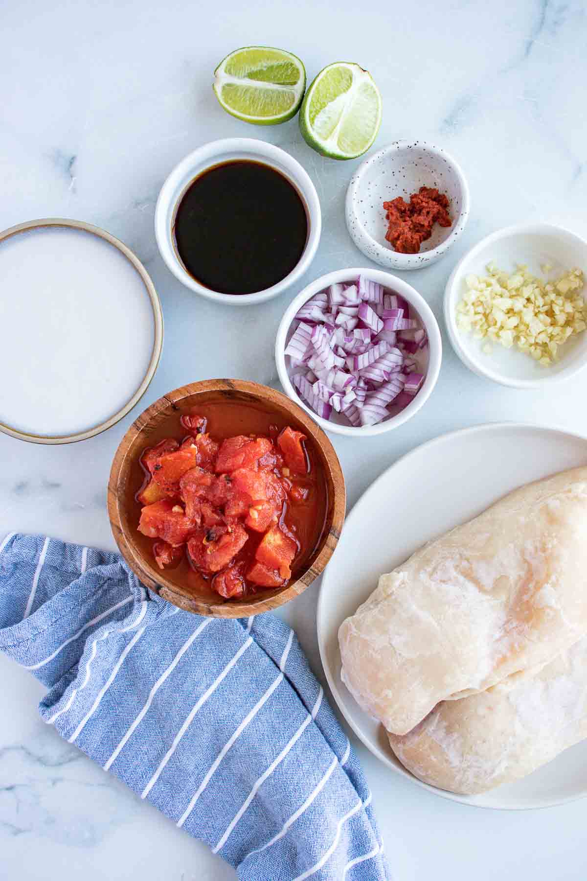 Ingredients for Thai Chicken: Chicken breasts, coconut milk, lime juice, curry paste, soy sauce, fire roasted tomatoes, and red onion