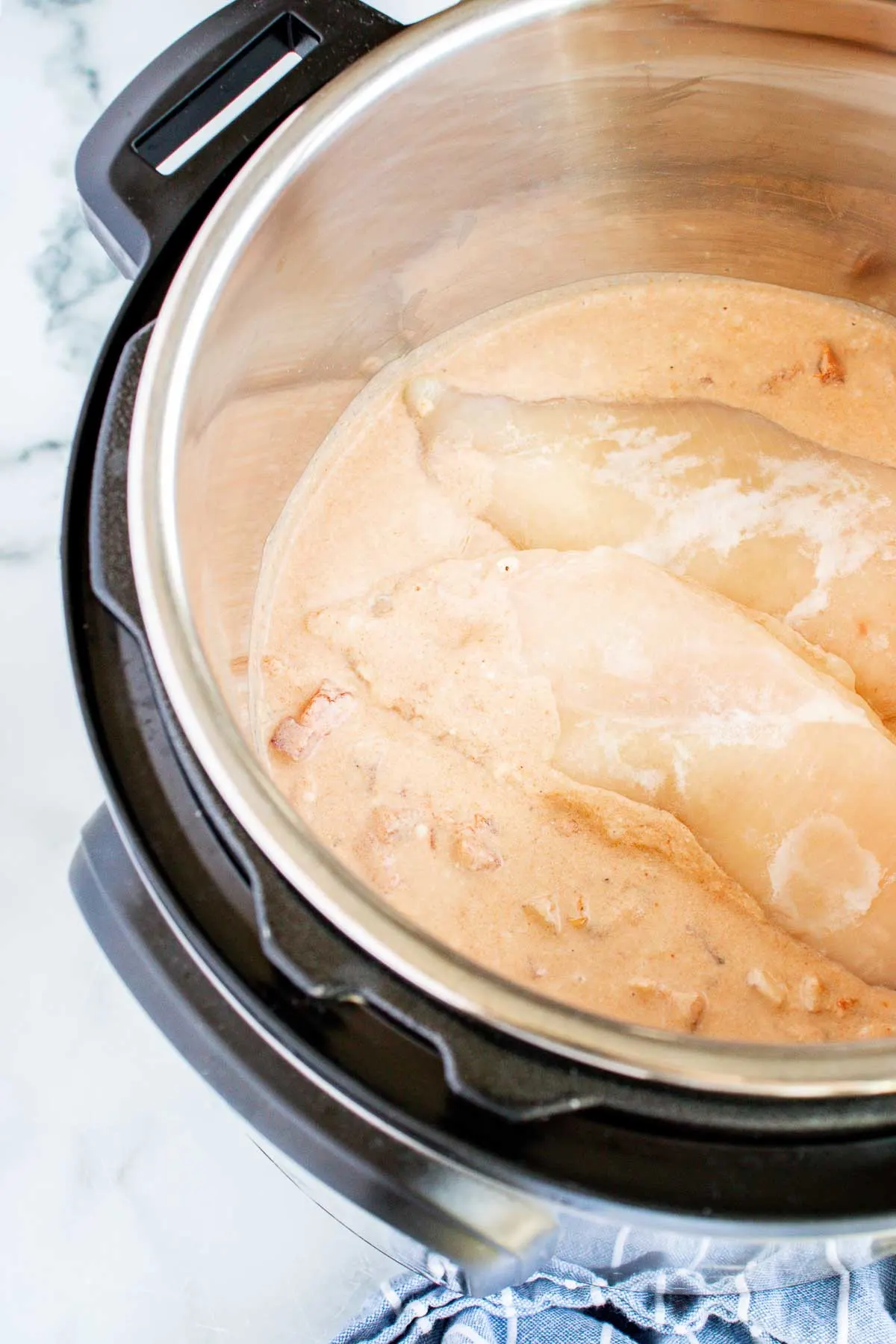 Add the chicken to the Instant Pot full of coconut milk sauce.
