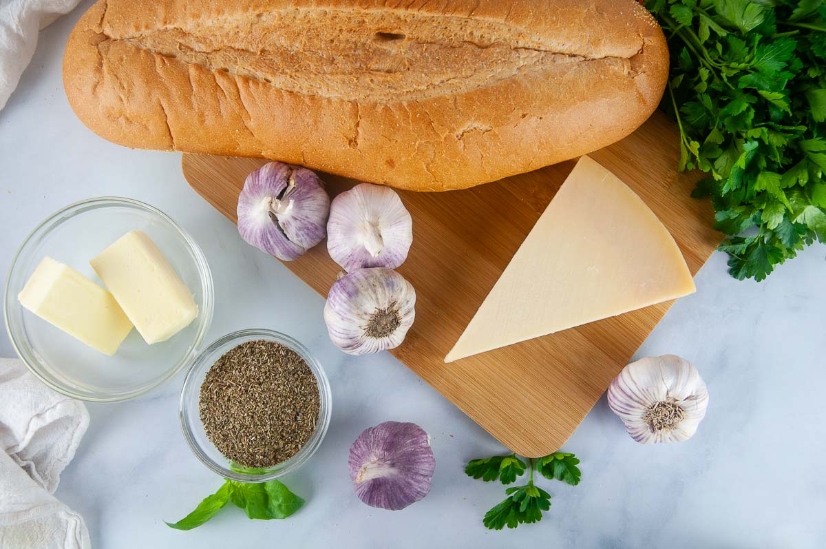 Garlic bread ingredients: Italian bread, Italian seasoning, garlic, butter, and cheese