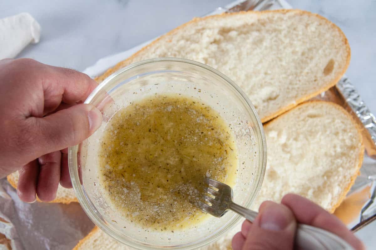 Melt the butter and stir in the garlic and herbs