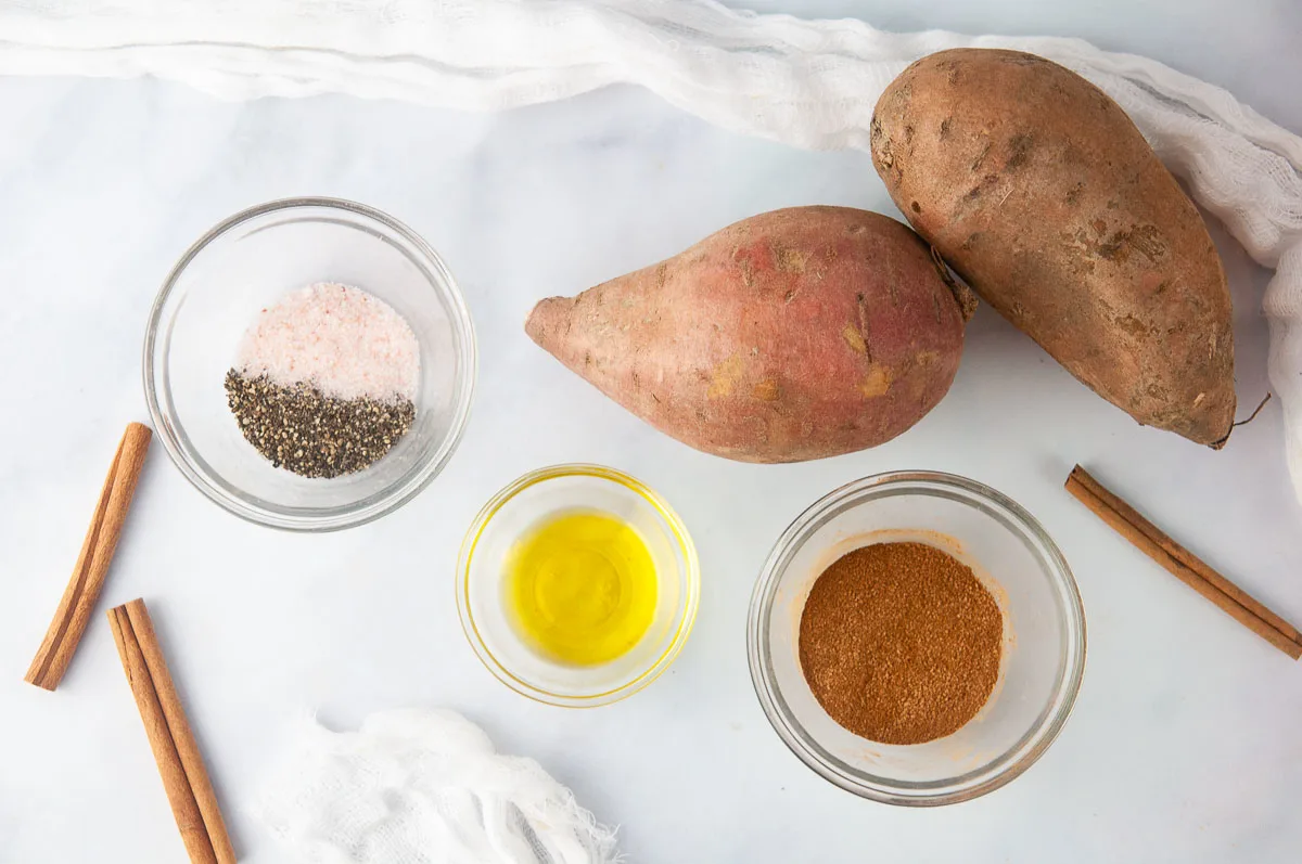 Ingredients for cinnamon sugar sweet potato fries: Sweet potatoes, olive oil, cinnamon, salt, and pepper