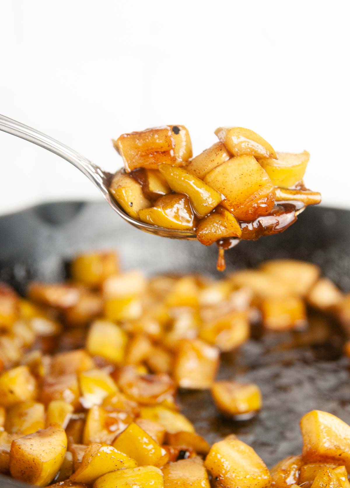 A spoonful of easy fried apples- a yummy fall or holiday side dish or a perfect pancake or icing topping