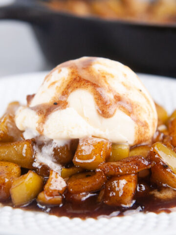 Easy fried apples under a scoop of vanilla ice cream make a delicious fall dessert.