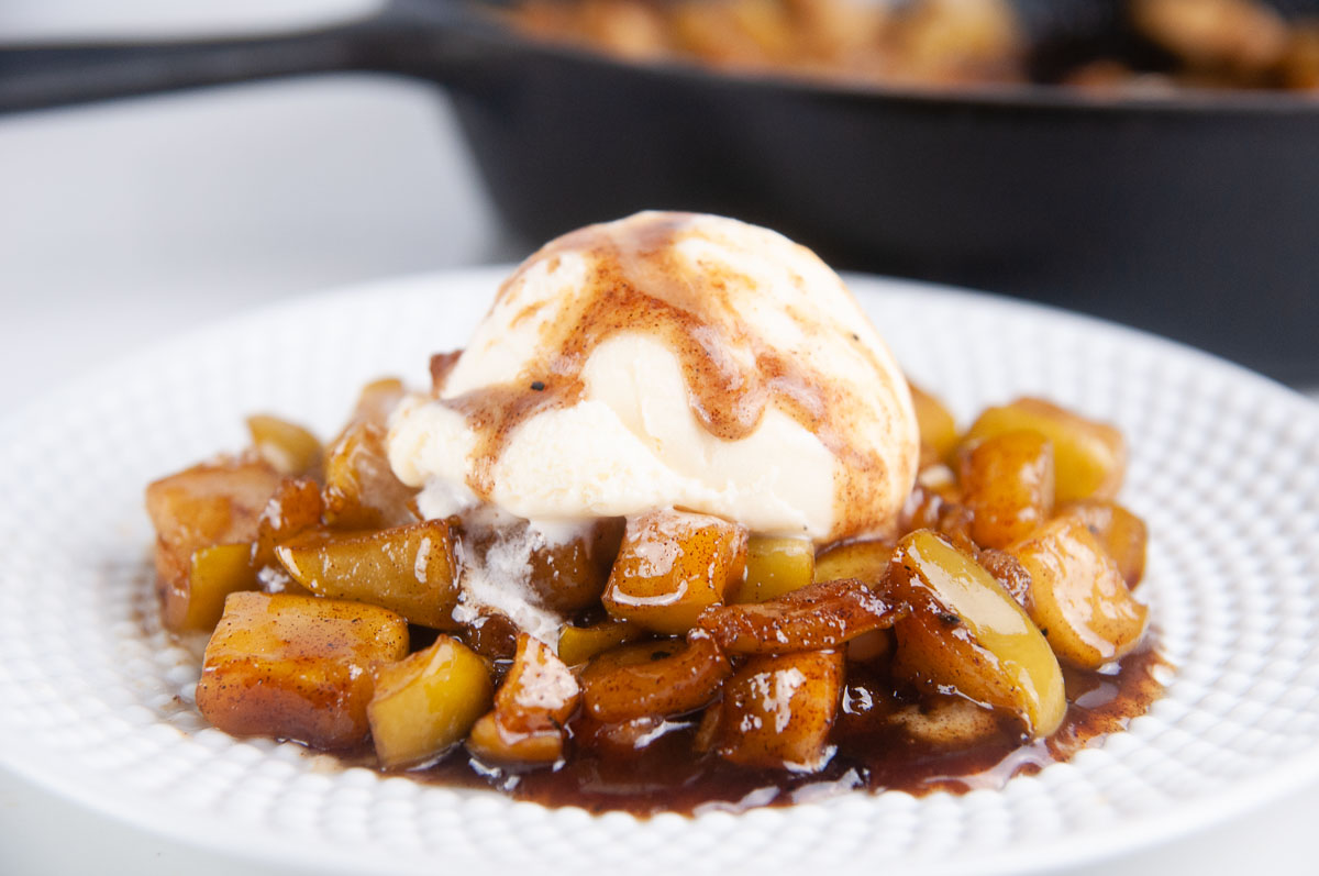Easy fried apples under a scoop of vanilla ice cream make a delicious fall dessert.