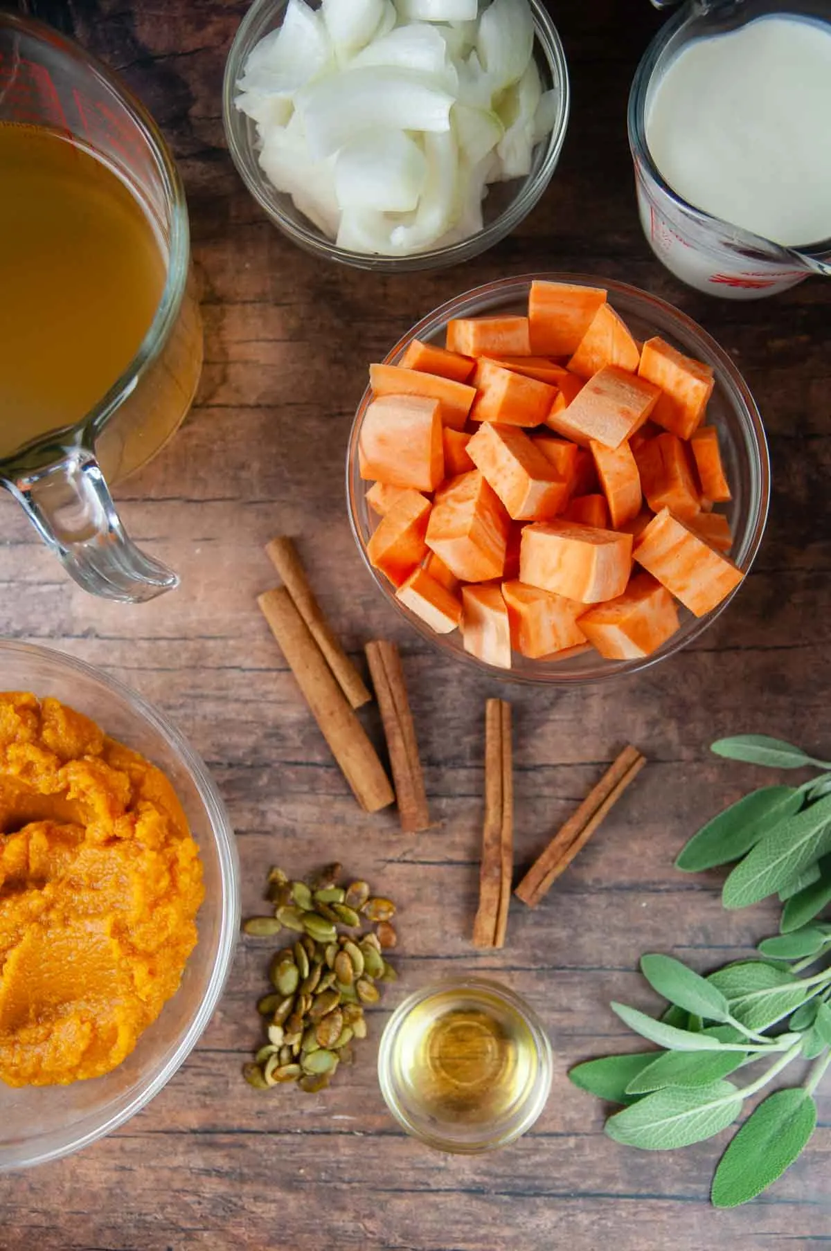 Ingredients for Sweet Potato and Pumpkin Soup: Pumpkin, Sweet Potato, Onions, Broth, Spices, Olive Oil, and Cream