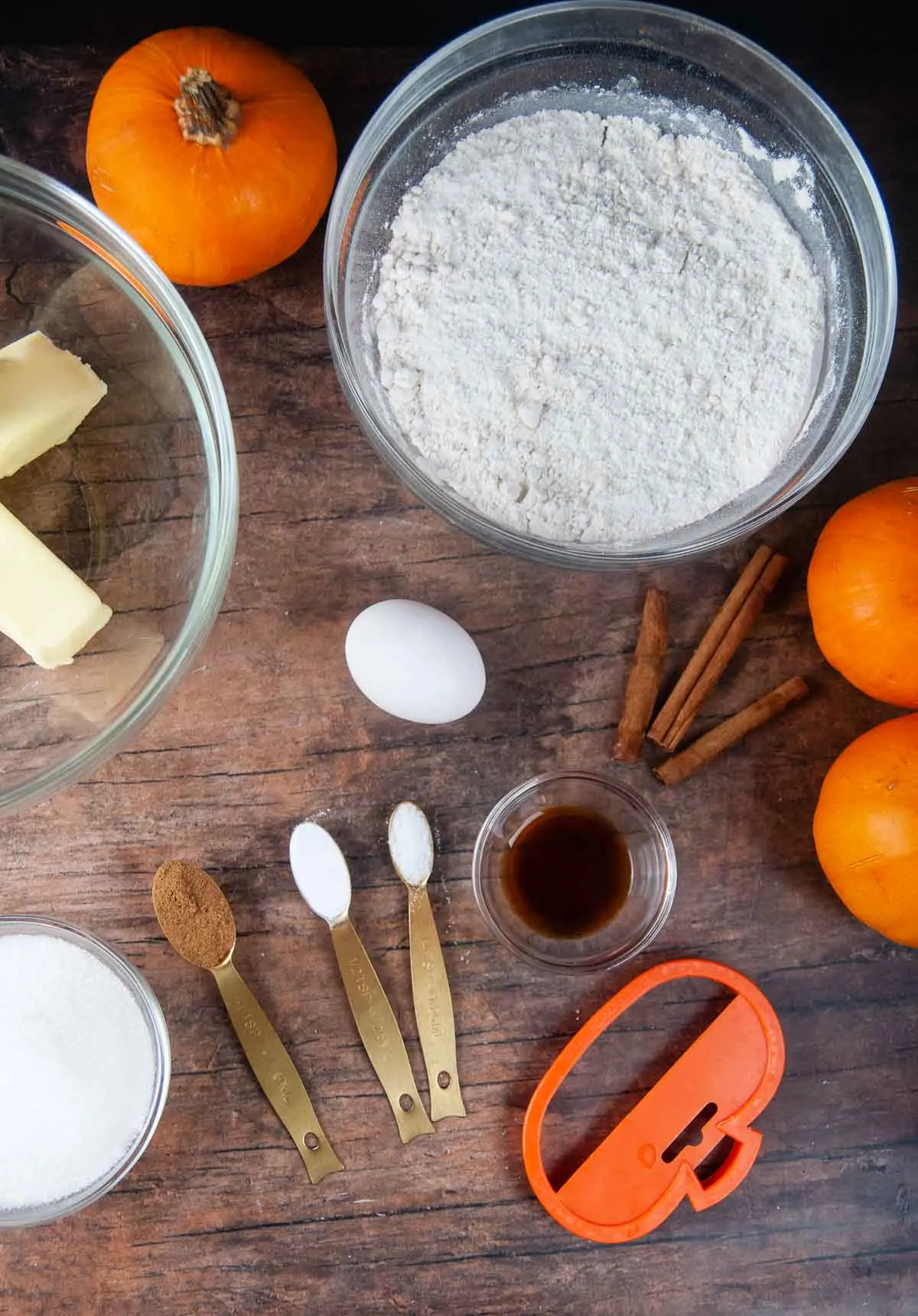 Ingredients for cut out pumpkin spice cookies: flour, egg, baking powder, sugar, butter, salt, pumpkin spice, vanilla