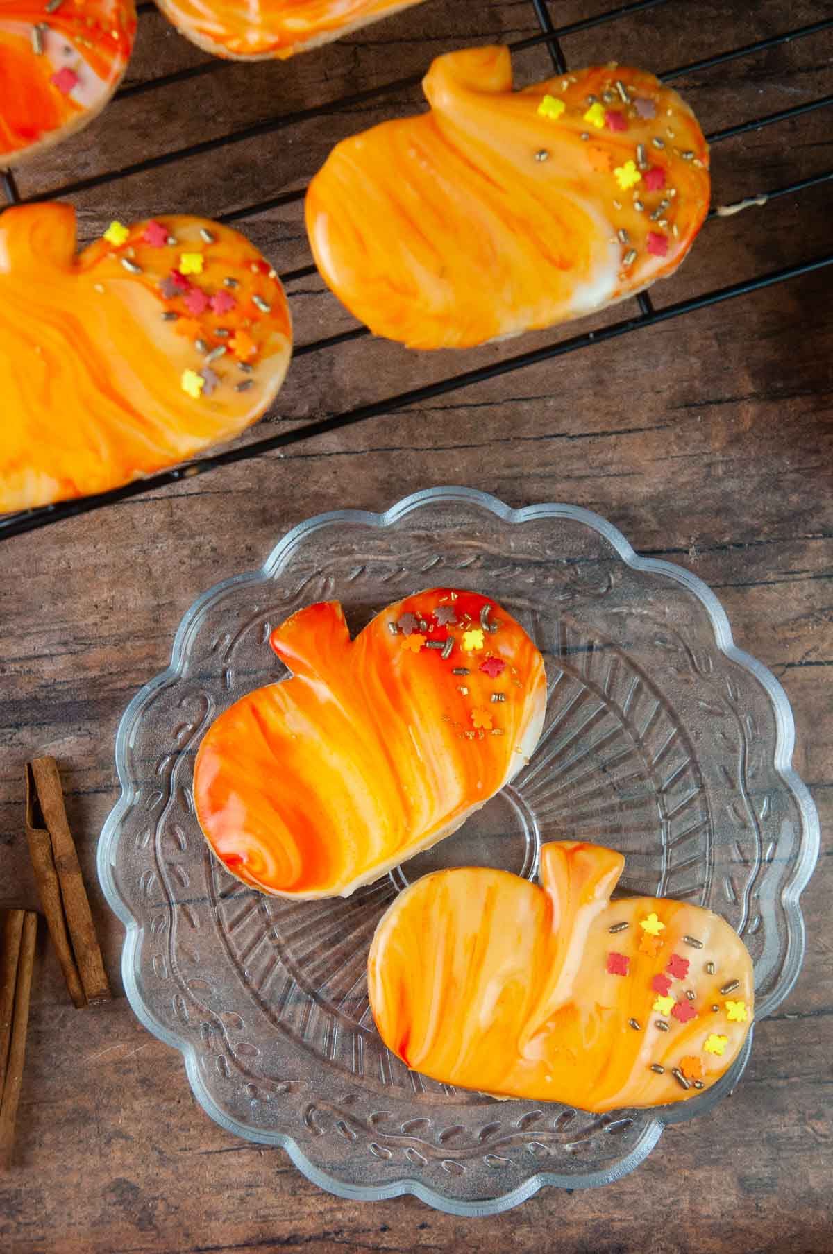 Marbled icing and sprinkles is an easy way to decorate pumpkin spice cut out cookies.