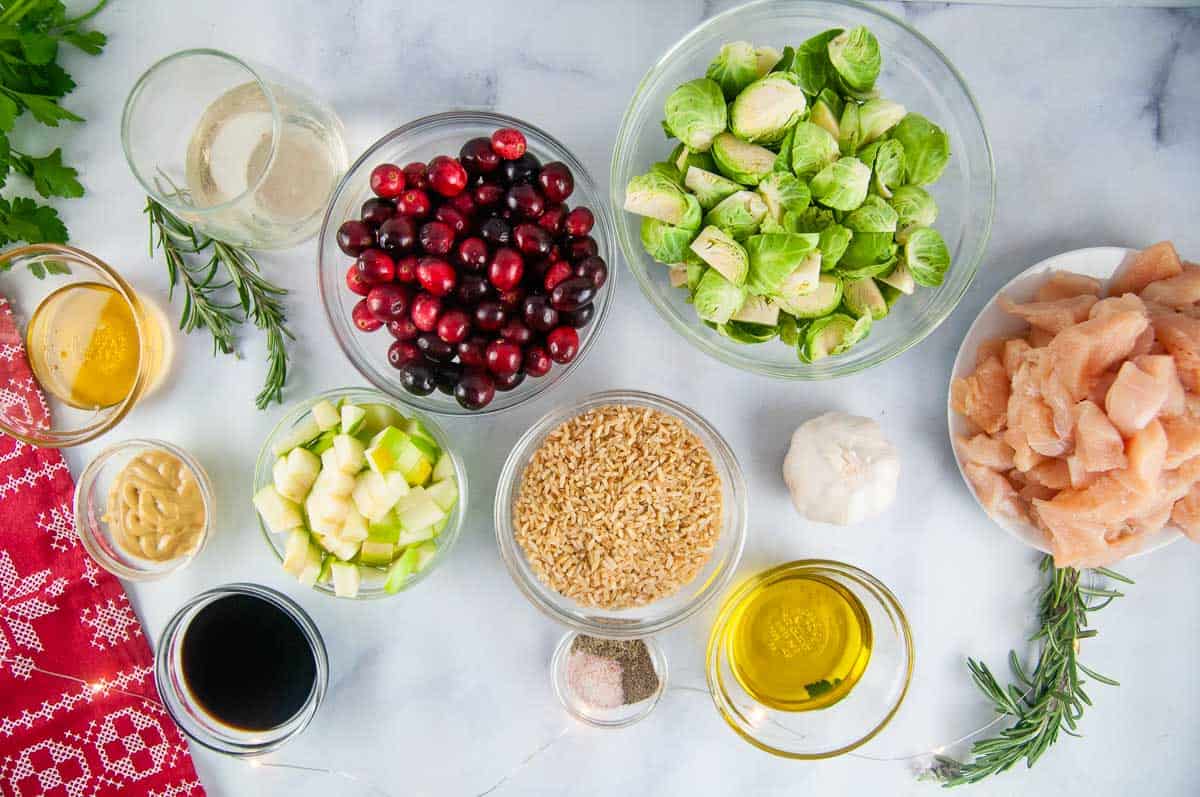 Cranberry Chicken and Rice Skillet Ingredients: Chicken, Rice. Cranberries, Brussels sprouts, Granny Smith apple. Olive oil, honey, wine, dijon, spices, garlic