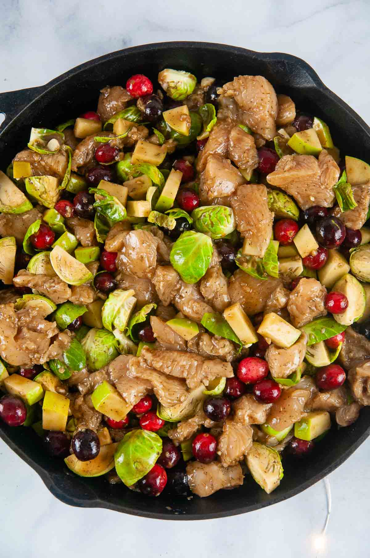 Pour the cranberry chicken mixture onto the rice in the skillet.