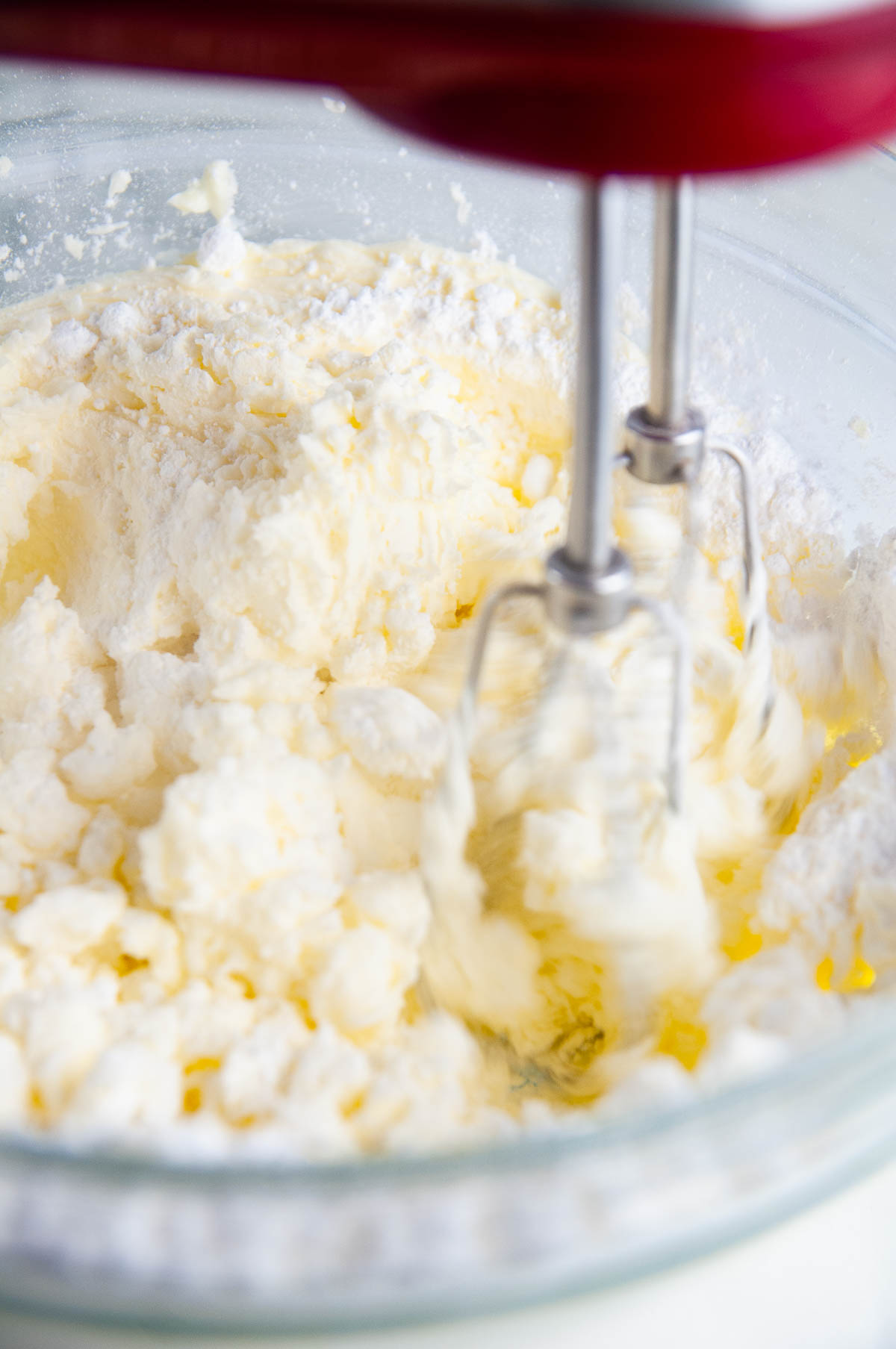 Beat the butter with the sugar, cream, salt, and vanilla to make vanilla buttercream.