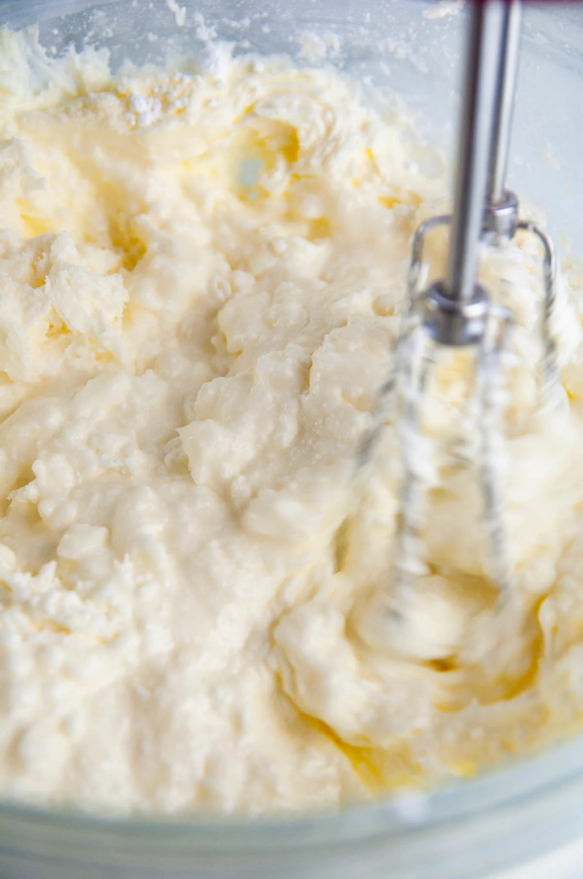 Beat the butter with the sugar, cream, salt, and vanilla to make vanilla buttercream.