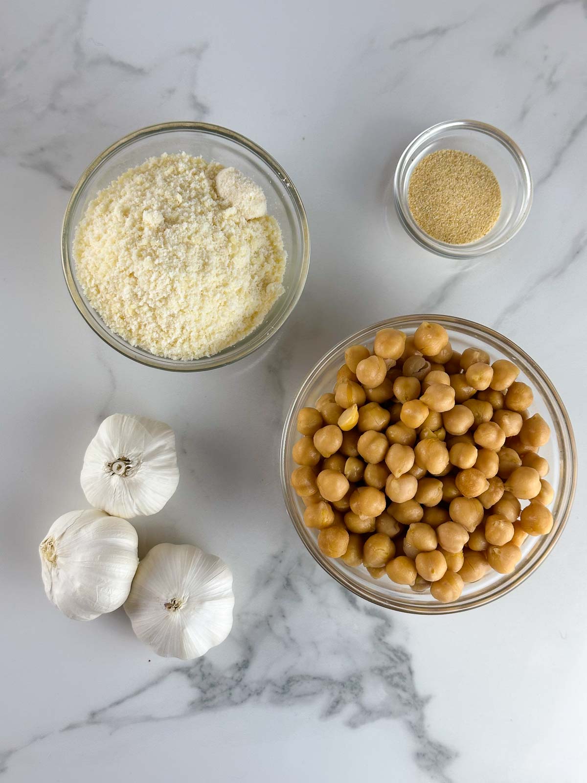 Ingredients for Easy Garlic Roasted Chickpeas with Parmesan: Chickpeas, Garlic Powder, and Parmesan Cheese