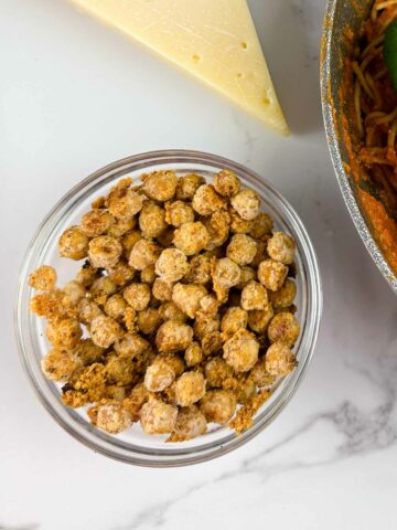 Easy garlic roasted chickpeas with parmesan are a yummy crunchy snack, and topping for salads, soups, and pastas