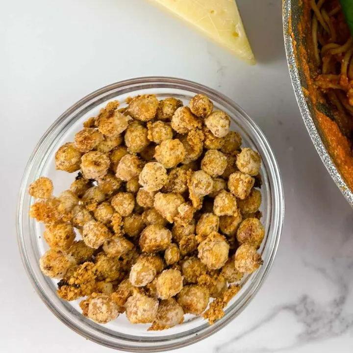 Easy garlic roasted chickpeas with parmesan are a yummy crunchy snack, and topping for salads, soups, and pastas