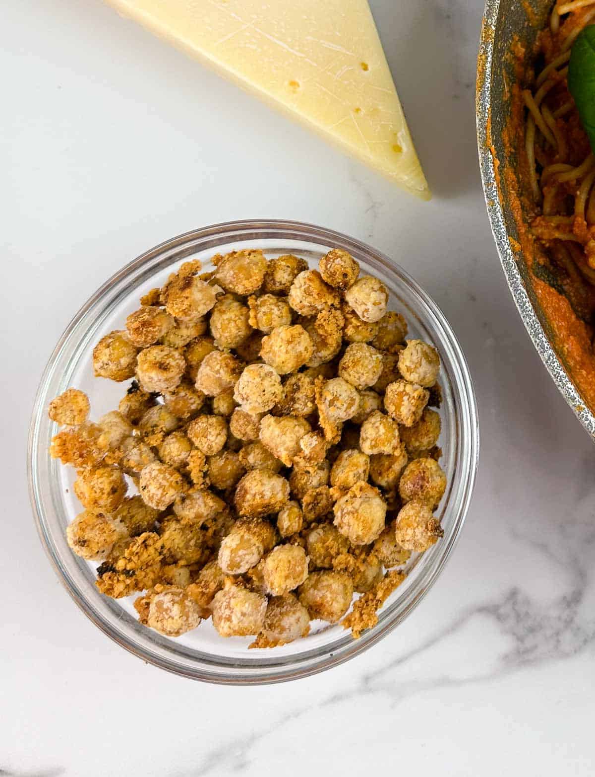 Easy garlic roasted chickpeas with parmesan are a yummy crunchy snack, and topping for salads, soups, and pastas