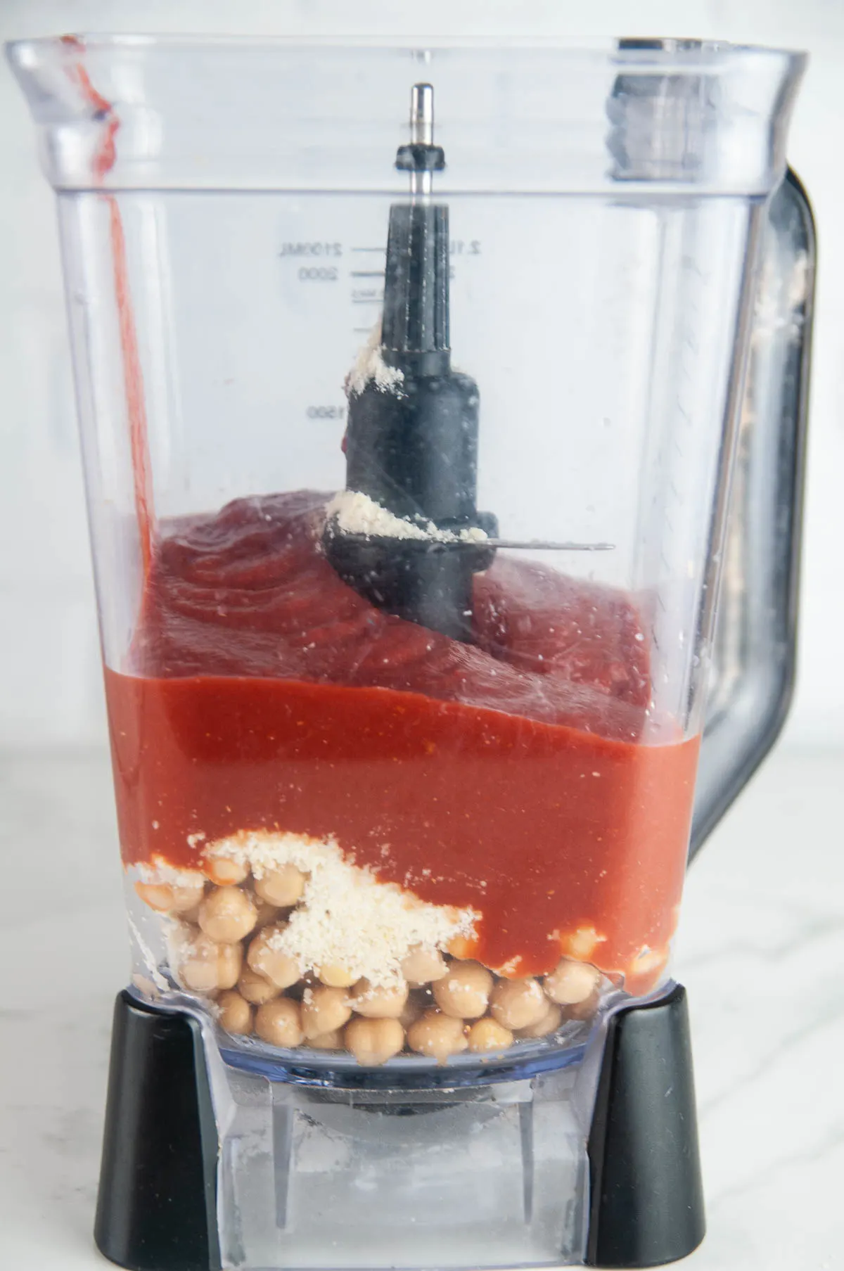 Put the ingredients for chickpea sauce in a blender.