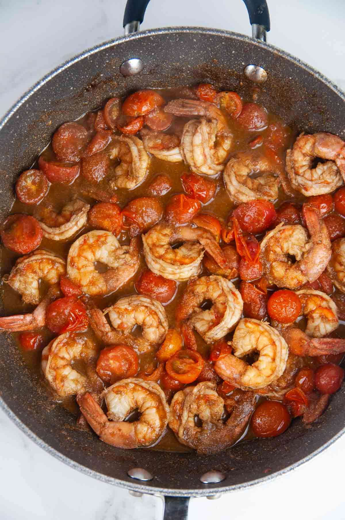 Cook the cherry tomatoes until they burst.