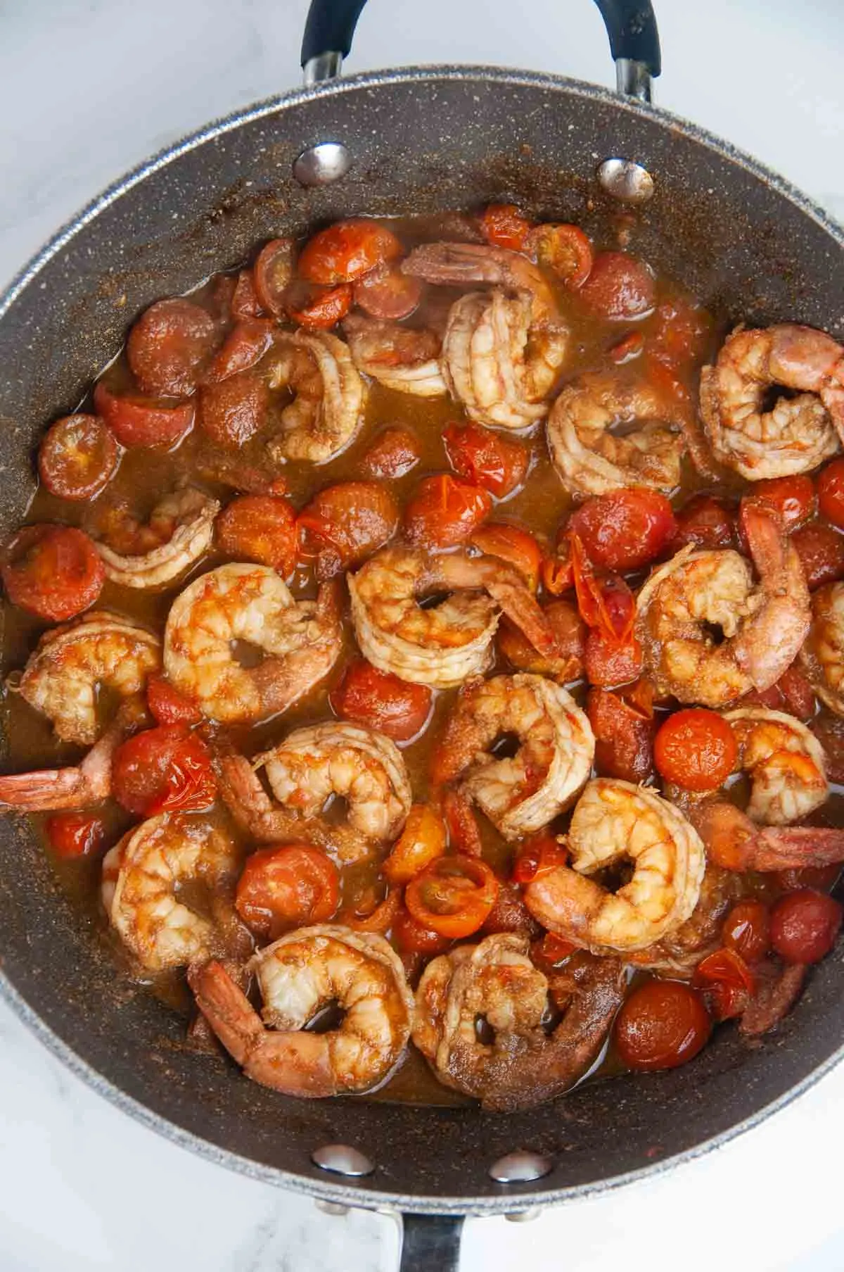 Cook the cherry tomatoes until they burst.