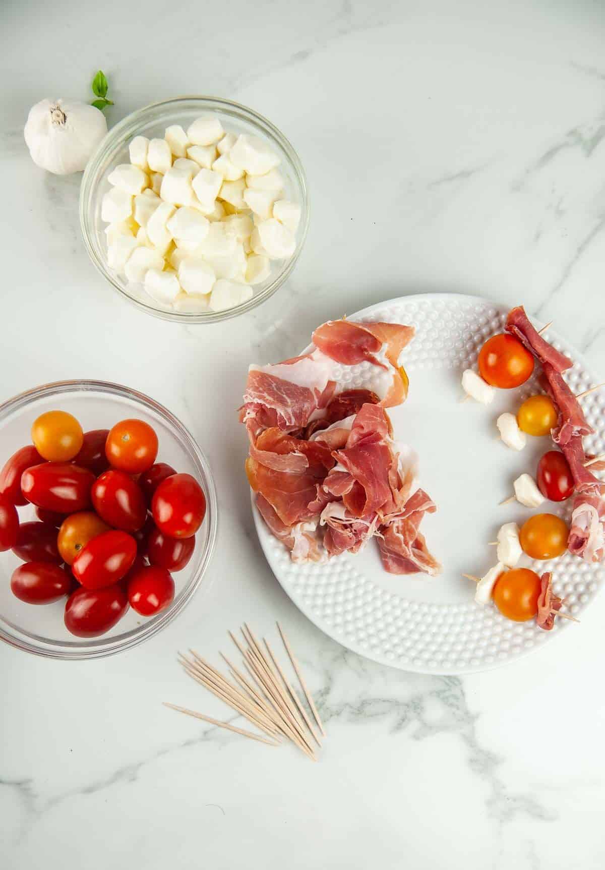 Assembling Prosciutto Caprese Skewers