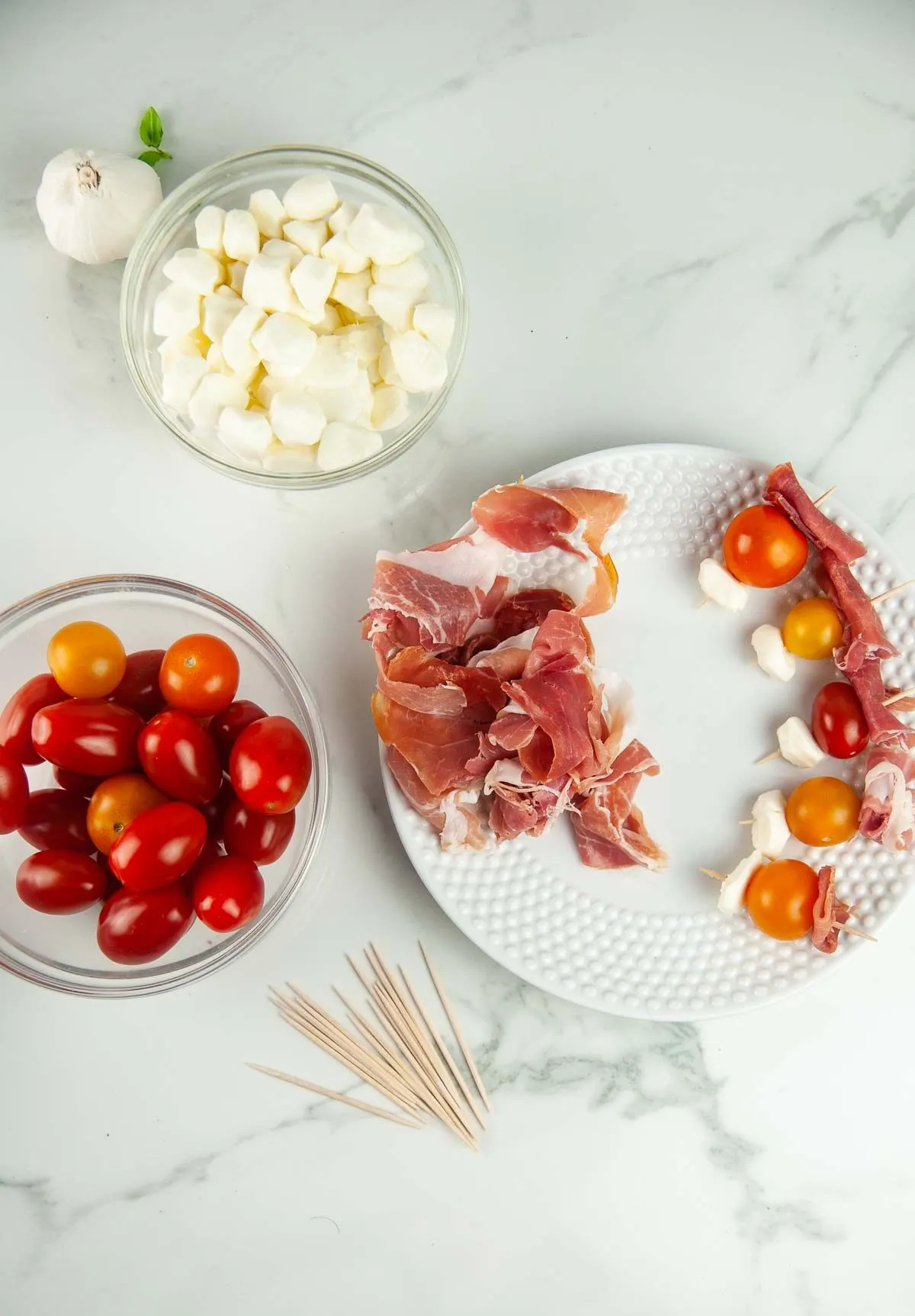 Assembling Prosciutto Caprese Skewers