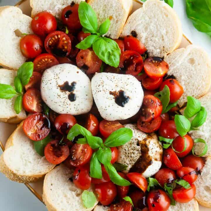 Burrata caprese salad takes the classic flavors of the tomato, mozzarella, and basil combination and turns it up a notch with decadent burrata cheese. This easy variation of caprese with burrata makes for an effortlessly elegant dinner or appetizer anytime.